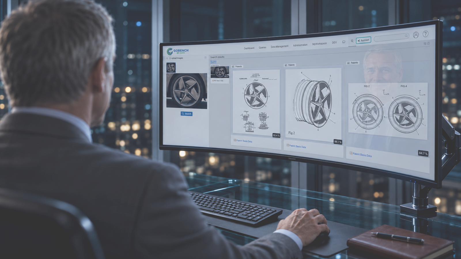 Executive reviewing patent search results in GOBENCH on a curved monitor at night